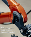 Close-up of Universal Derailleur Hanger for SRAM UDH Standard Beefed Up 6061 Alloy Body with black finish attached to bike frame