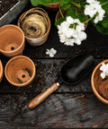 Garden Scoop Shovel For Transplanting And Planting Stainless Steel Do It All Hand Digging Tool With Wide Bowl on wooden table