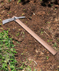 Stainless Steel Pickaxe Mattock For Gardening And Outdoor Work Handheld Tool on soil with wooden handle, rust-resistant steel head