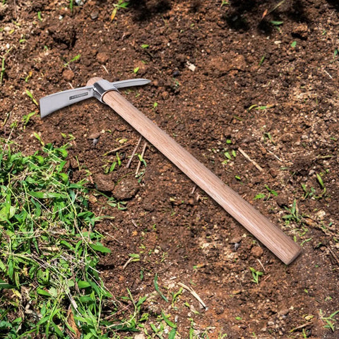 Stainless Steel Pickaxe Mattock For Gardening And Outdoor Work Handheld Tool on soil with wooden handle, rust-resistant steel head