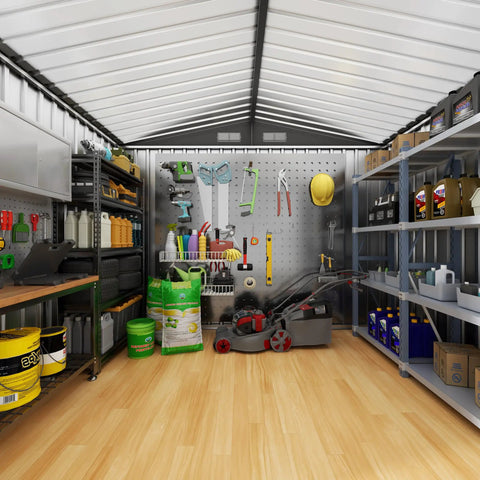 Interior view of a rugged metal storage shed with sloping roof for backyard and patio, organized with tools and lawn equipment.