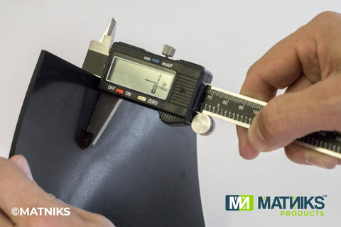 Measuring thickness of Premium Silicone Rubber Sheet 12 By 12 Inches One Eighth Inch Thick Black High Temperature Gasket Material