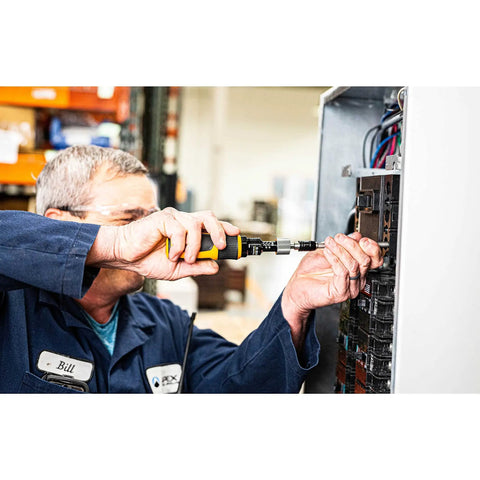 Technician using quarter inch drive torque screwdriver with pro grade build on an electrical panel, adjustable 10 to 50 inch pounds