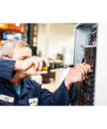 Technician using One Quarter Inch Drive Torque Screwdriver With Locking Collar And Quick Release Bit Holder on electrical panel