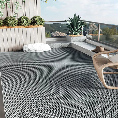 Grey Commercial Drainage Mat Non Slip Floor Mat 3x10 Ft 0.22 Inch Thick for outdoor patio, shown in place with planters around.