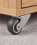 2 Pack Low Profile Anti Sag Caster Wheels Featuring Slick 360 Degree Swivel Action and Hassle Free Door Support Rollers mounted under dresser.