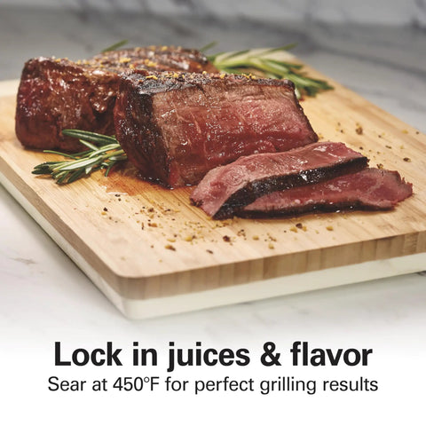 Cooked steak on a cutting board demonstrating sear quality of Indoor Searing Grill With Viewing Window And Adjustable Temp To 450F 118 Square Inches Cooking Surface Serves Six PFAS Free Removable Nonstick Grate Stainless Steel