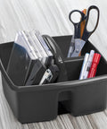 Black three compartment cleaning caddy for home and office with ergonomic handle, holding supplies like scissors and folders.