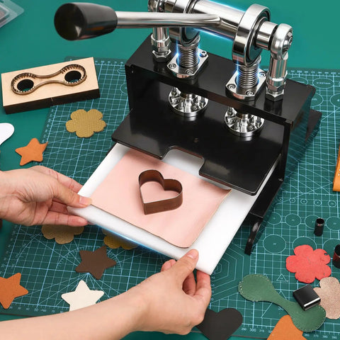 Hands using Beast Of A Leather Cutting Press 1.5 Ton With 20x20cm Work Bed Dual Guide Shafts And 39 Piece Hole Punch Tool Set for leathercraft