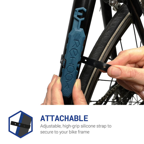 Close-up of blue on-bike chain tool attaching to frame, labeled 'attachable'; Attach To Your Bike And Get The Chain Back In Seconds Without The Mess A Handy On Bike Attachment For Quick Rear Gear Fixes Perfect Stocking Filler Blue Color Seen On Dragons Den And Loved By Cyclists.