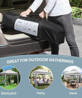 Easy Up 11x11 Pop Up Gazebo Shelter With 4 Sandbags in carrying case being placed in car trunk, showing portability.