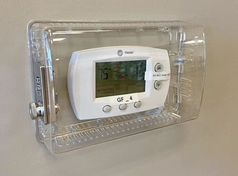 Lockable Thermostat Cover With Combination Lock Clear Polycarbonate Wall Mount Lock Box Fits 4.5 x 7 x 2.5 showing installed cover