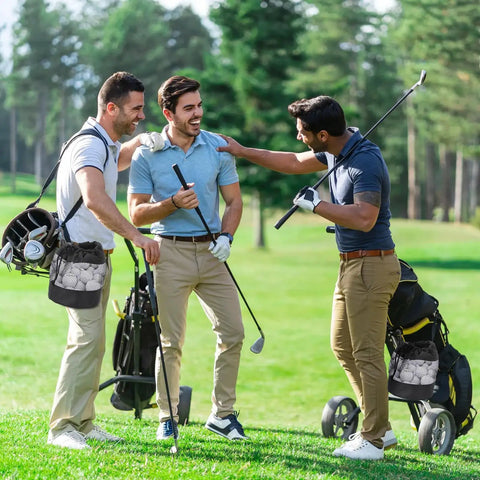 Golfers with 2 Pack Go-To Golf Ball Storage Bags With Nylon Mesh Pouches enjoying a day at the range on a sunny green course.