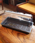 Prism Lens Powered LED Mini Greenhouse Kit With NanoTech Light Reflector And Double Thick Tray on wooden table.