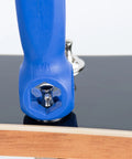 Close-up of Octopus 8 In 1 Tech Tool with five hex wrenches in use on a guitar tuning machine. Blue ergonomic grip visible.