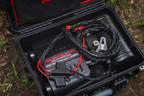 Tough As Nails Portable 12V Dual Cylinder Air Compressor Pump 150 Psi and 6 16 Cfm Fast Tire Inflator inside durable carrying case.