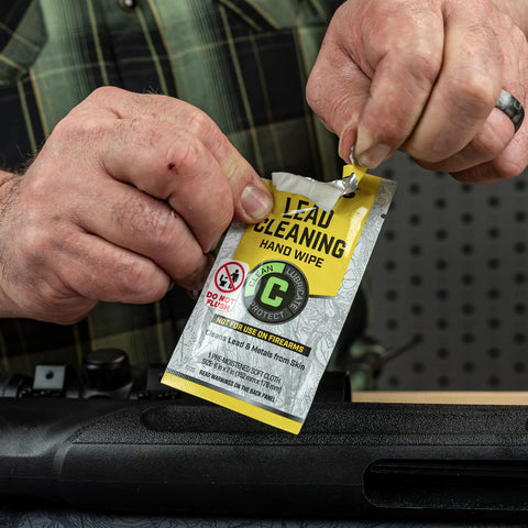Person using lead cleaning hand wipe for Airgun Maintenance And Cleaning Kit With Silicone Lubricant And Portable Case.