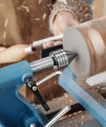 Heavy Duty MT2 Live Tailstock Center For Wood Lathe With 60 Degree Ball Bearing Tip in use, securing a wooden bowl on lathe.