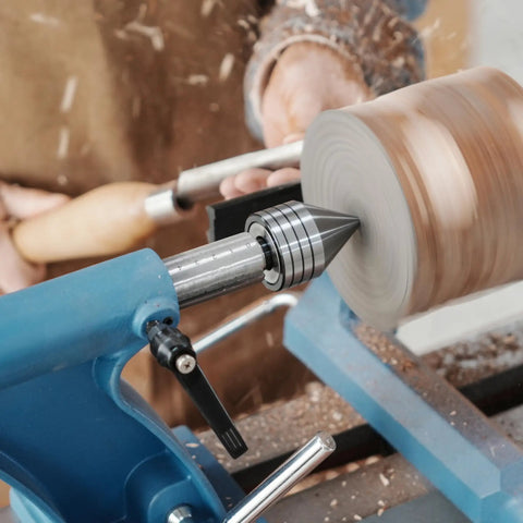 Heavy Duty MT2 Live Tailstock Center For Wood Lathe With 60 Degree Ball Bearing Tip in use, securing a wooden bowl on lathe.