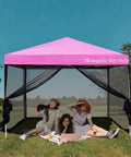 10x10 Mosquito Net With Zipper For Patio Gazebo And Canopy Tent shown on pink canopy with people inside on grass