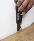 EasyScribe Scribing Tool for Accurate Layouts Across Carpentry, Joinery, Tiling, Kitchen Fitters, and Shop Fitters in use on wall trim