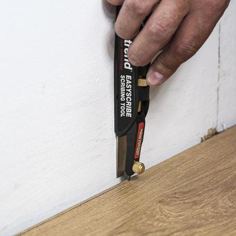EasyScribe Scribing Tool for Accurate Layouts Across Carpentry, Joinery, Tiling, Kitchen Fitters, and Shop Fitters in use on wall trim