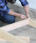 Man assembling Heavy Duty Workbench Kit With ShelfLinks For Garage Shop Or Shed Organization Build A Custom Workspace With Sturdy Brackets