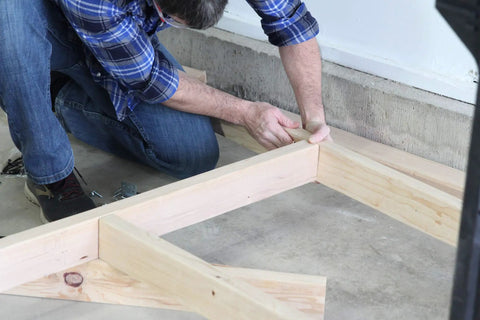 Man assembling Heavy Duty Workbench Kit With ShelfLinks For Garage Shop Or Shed Organization Build A Custom Workspace With Sturdy Brackets