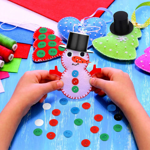 Hands holding snowman craft from Awesome Christmas Craft Button Kit With 700 Pieces Includes 50 Mini Black Top Hats 50 Carrot Noses