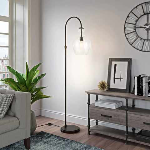 Tall Arc Floor Lamp With Glass Shade In Blackened Bronze And Clear Finish, Dope 70 Inch Standing Lamp in a modern living room.