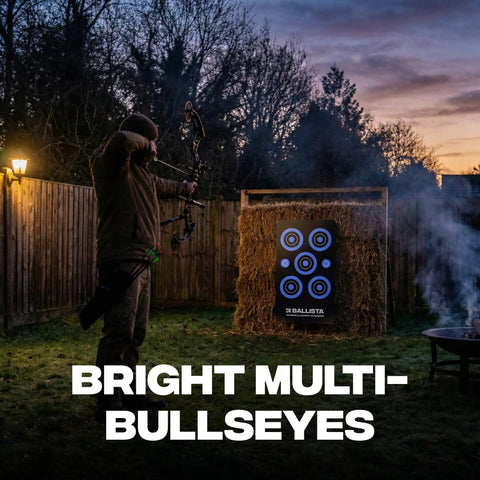 Archer practicing with Reusable Self Healing Rubber Archery Target Face Roll Up Practice Target Sheet With Bright Bullseyes at dusk