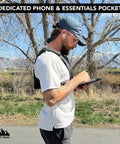 Man wearing Everyday Chest Pack For Hiking, Skiing, Running And Travel With Grab And Go Phone Pocket outdoors