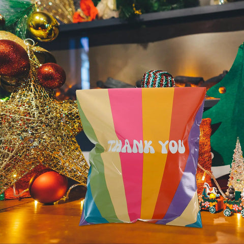 Rainbow Color Waterproof Poly Mailer Bags 100 Count Self Sealing Shipping Envelopes with 'Thank You' in festive setting