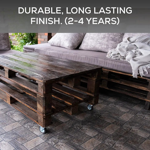 Outdoor patio with wooden pallet furniture, stone flooring sealed with Matte Clear Acrylic Sealer For Stone And Brick.