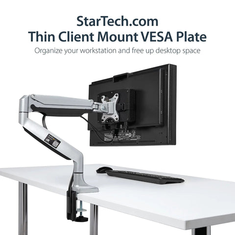 Under Desk Thin Client Mount For Mini PCs And Docking Stations VESA Bracket Fits Mac Mini And Intel NUC Adjustable From 0.7 To 2.8 Inches Back Of Monitor Mount Keeps Cables Tidy And Frees Desk Space, shown on white desk with monitor and keyboard.