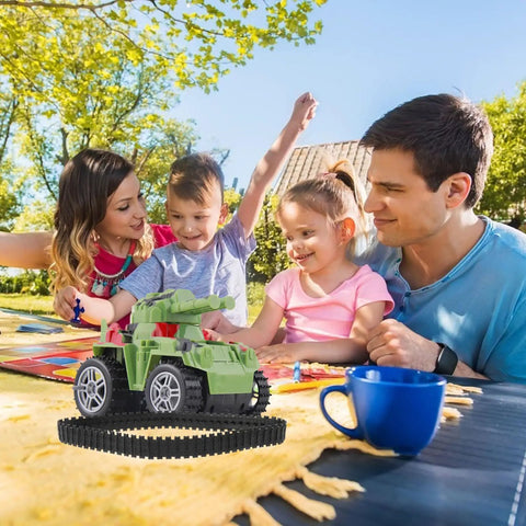 Family playing outdoors with toy vehicle featuring Two Pack Rubber Tank Tracks For RC Chassis Long Wide DIY Replacement For Crawlers.