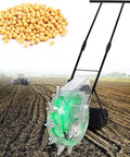 Hand Push Roller Seeder Spreader Manual Seed Planter And Fertilizer Applicator with 12 Beak Precision Iron Beak in field
