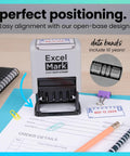 Badass Date Stamp Featuring Custom Text Options And Dual Blue Red Ink With A Legit Gray Mount That Gonna Keep Your Documents Looking Sharp For Years Of Daily Professional Use on an alignment mat with paperwork.