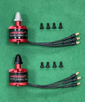 Buttery Smooth A2212 Brushless Motor Set 920KV with connectors and screws on green background for drone building.