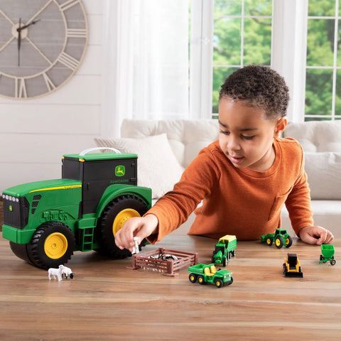 Child playing with John Deere Tractor Toys Value Set With Portable Carrying Case For Kids On The Go Farm Toy Organizer Packed With 18 Die Cast Vehicles