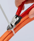 Pro Grade Flush Cut Diagonal Cutters Set 2-Piece With Spring Loaded opening cutting a zip tie on orange cables