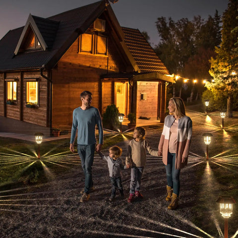 Outdoor Solar Lights 4 Pack Waterproof Garden Pathway Driveway Yard Lights With Auto On Off, illuminating a pathway near a house