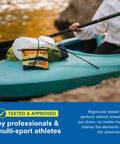 Adventure Medical Kit Ultralight/Watertight Medical Kit .5 on a blue kayak deck with a white dry bag.