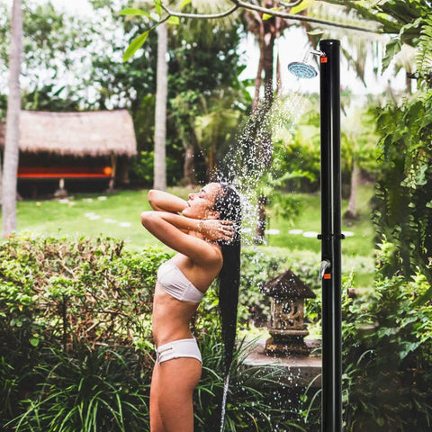 Solar Heated Outdoor Shower With Two Section Setup, 7.2Ft Tall And 5.5 Gallon Capacity installed in a garden