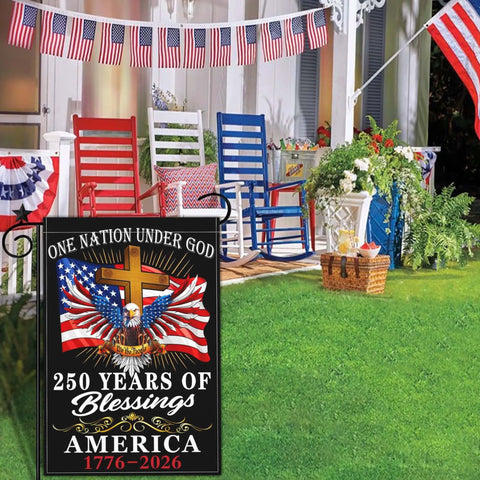 Patriotic 250th Anniversary USA Flag For Outside Garden Decor 12x18 Inch Double Sided We The People 1776 Celebration Flag For 4th Of July Outdoor Display with cross and eagle in garden setting.
