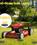 8 Pack Solar Ground Lights IP65 Waterproof LED in Ground Lights for Pathway shown with lawn mower on green grass