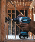 Hard Core Bad Boy 18V Cordless Hammer Driver Drill Kit Featuring 1/2 Inch Chuck And Two Speed Transmission in action drilling wood.
