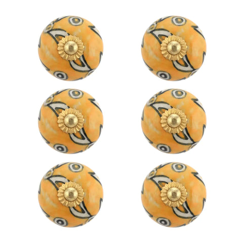 Prime Pick Handmade Ceramic Cabinet Knobs And Drawer Pulls For Kitchen Cupboard Or Bedroom Wardrobe - Super Slick Boho Furniture Handles In Warm Mustard Yellow - Pack Of Four - Close-up of six warm yellow knobs with floral metal bases.