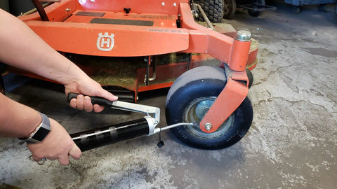Using Heavy Duty Lever Grease Gun That Feels Like A Beast, 10,000 PSI Power on mower wheel