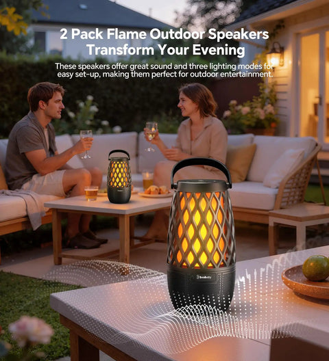 Couple enjoying evening with 2 Multi Sync Bluetooth Lantern Speaker With Lights And 360 Degree Stereo Sound on outdoor patio.